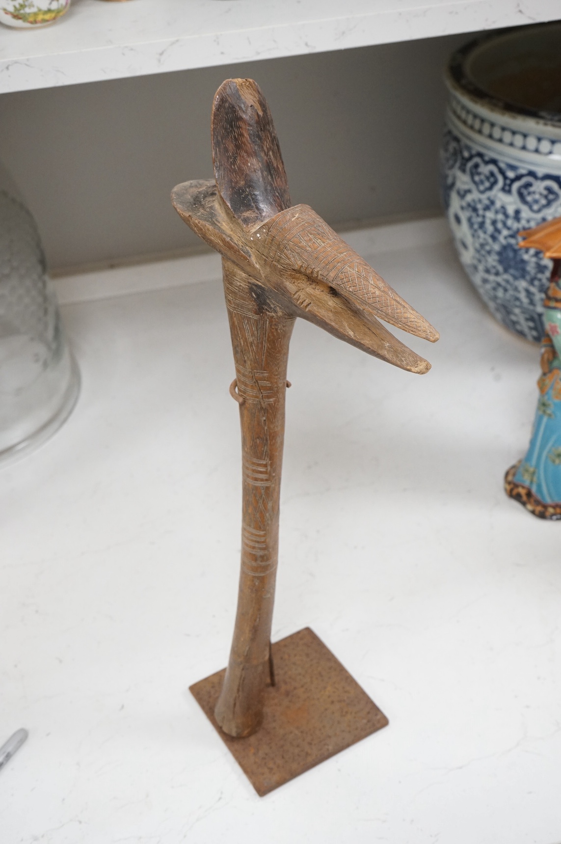 An African tribal club with incised carving, 50cm high. Condition - some chipping